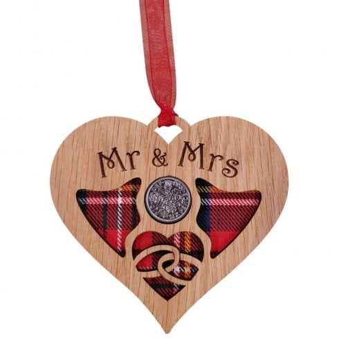 A unique keepsake gift with a Scottish twist.  The sixpence is mounted onto hanging oak veneered wooden heart with tartan inserts, mounted on card and packaged in clear cellophane packets.  The sentiment 'Mr & Mrs' is engraved across the heart.